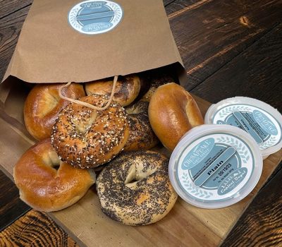 Dozen bagels with wood background